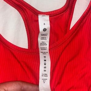 size 8 orange/red lululemon tank top.